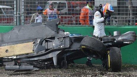 Fernando Alonso walks away from his car