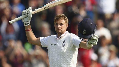 Joe Root celebrates his 100