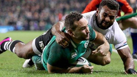 Dave Kearney touches down Ireland's second try despite the efforts of Fijian Timoci Nagusa