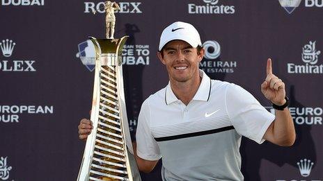 McIlroy celebrates with the Race to Dubai trophy