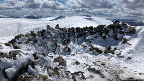 A dry stone wall covered in snow in Keswick.