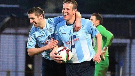 Allan Jenkins celebrates scoring a hat-trick against Warrenpoint