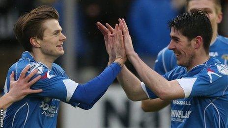 Paul McElroy (left) celebrates scoring against Glentoran