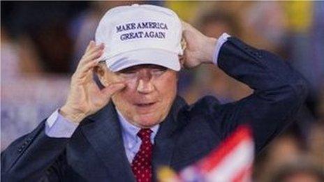 US Republican presidential candidate Donald Trump introduces Alabama Senator Jeff Sessions during a rally