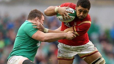 Taulupe Faletau is tackled by Jack McGrath