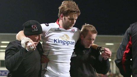 Iain Henderson requires assistance after suffering the hamstring injury