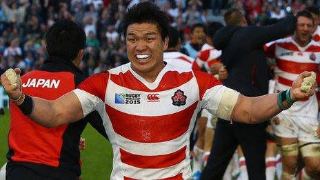 Japanese players celebrate their win over South Africa