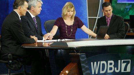 Thomas Milam, Steve Grant, Kimberly McBroom and Leo Hirsbrunner observe a moment of silence on a WDBJ programme