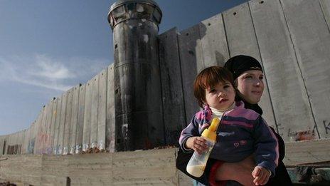 Mother and child by west bank barrier