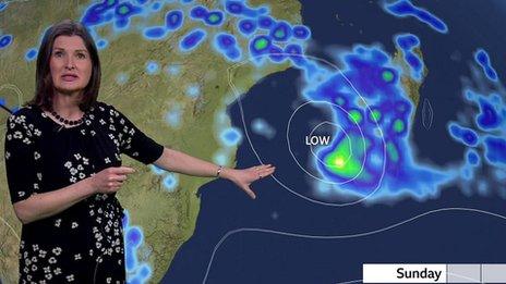 Helen Willetts stands in front of a weather map of eastern Africa showing the path of Storm Freddy by Sunday