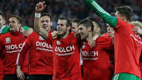 Wales players celebrate Euro 2016 qualification