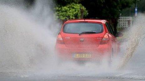 Red car in standing water