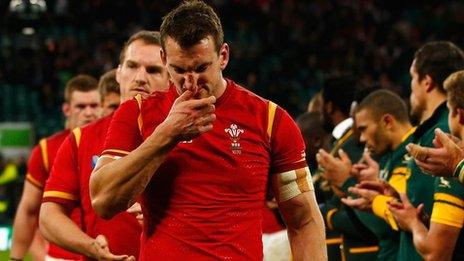 Sam Warburton leads Wales off after defeat at Twickenham