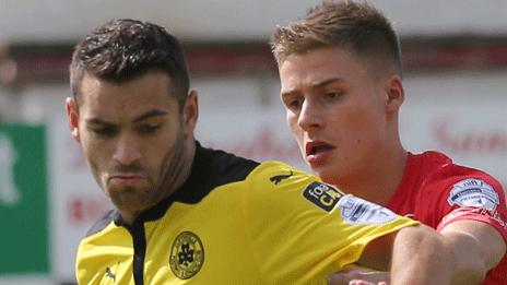 Cliftonville's David McDaid in action against Christian Stewart of Portadown