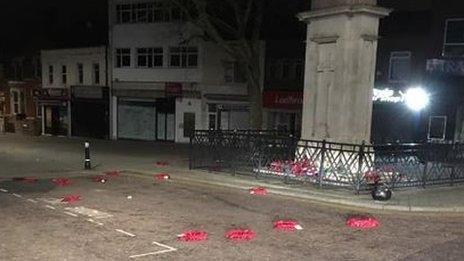 Wreaths strewn around the war memorial in Regent Street, Swindon