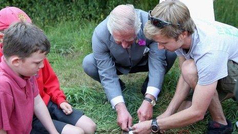 Prince Charles taking part in bush-skills class