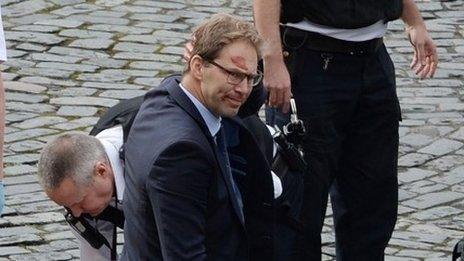 Conservative MP Tobias Ellwood helping emergency services