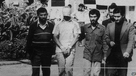 An American hostage being paraded before the cameras by his Iranian captors (November 1979)