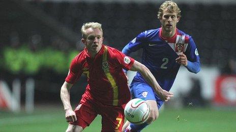 Wales' Jonathan Williams gets away from Croatia's Ivan Strinic