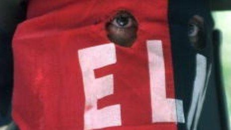 A rebel nicknamed Comandante Lenin of the Colombian guerrilla group, National Liberation Army (ELN), reads a communique to journalists as the group released 11 civilians, including politicians and a priest to the Colombian Red Cross April 10, 2002 in the Arauca province of Colombia.