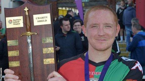 Stephen McAlorum with the Charity Shield after Glentoran's win over Crusaders