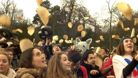 People in Sheffield flipping pancakes