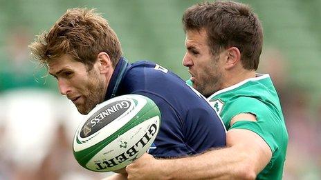 Scotland's Richie Vernon competes with Jared Payne of Ireland