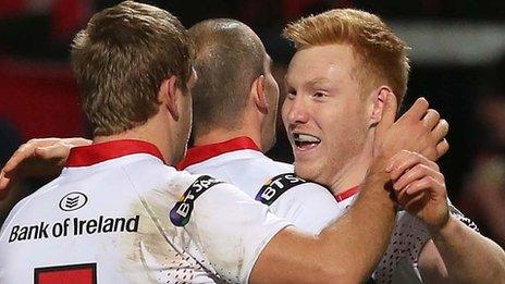 Rory Scholes celebrates scoring a try for Ulster