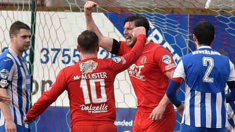 Portadown defender Ken Oman celebrates scoring the opener at Shamrock Park