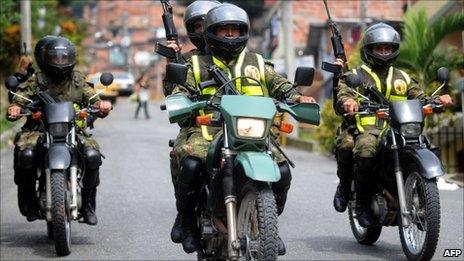 Troops on motorbikes patrol Medellin in photo from 19 June