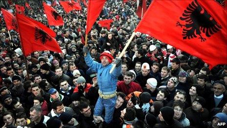 Photo taken on February 17, 2008 of Kosovars holding flags as they celebrate the independence of Kosovo in the capital Pristina