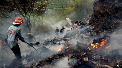 Pakistani rescue workers search for survivors at The Margalla Hills on the outskirts of Islamabad