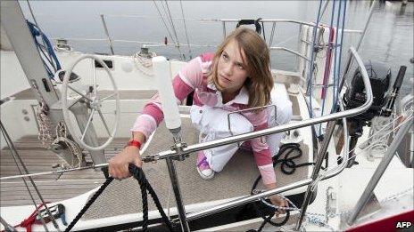 Laura Dekker on her boat, Guppy, in the harbour of Brouwershaven on July 27, 2010