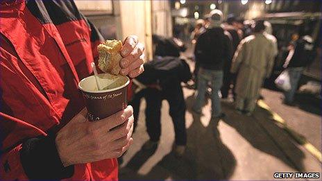 Homeless people being given food