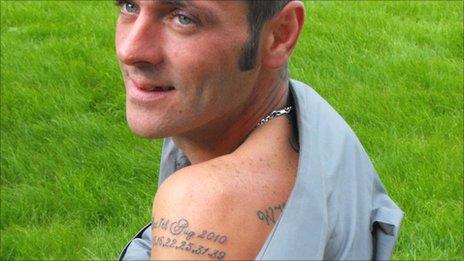 Wayne Hughes with the tattoo showing the date and numbers of his lottery win