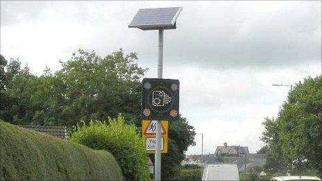 Damaged sign in Menai Bridge
