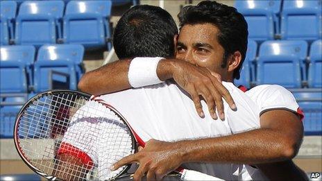 Rohan Bopanna of India, left, and partner Aisam-Ul-Haq Qureshi of Pakistan embrace after winning their semi-finals doubles match during the US Open tennis tournament in New York, Wednesday, 8 September 2010