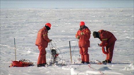 Workers look for gas and other underground deposits on the frozen Beaufort Sea