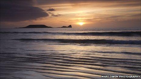 Worm's Head seen from Rhossili beach. Pic: Mari Owen Photography