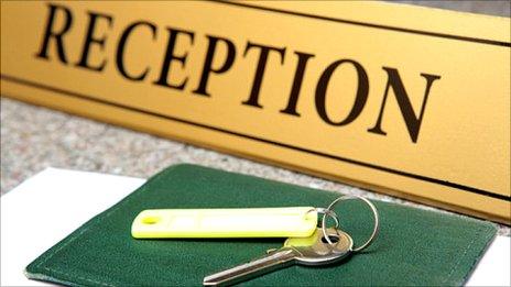 Hotel reception sign and door key