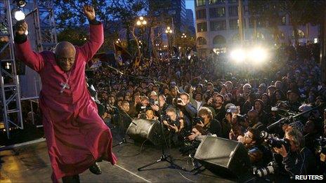 South African Nobel Peace Prize laureate Archbishop Desmond Tutu dancing off the stage in San Francisco