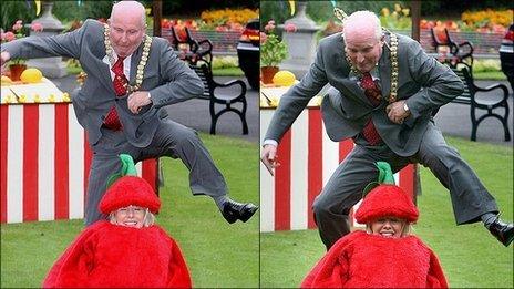 Jim Rodgers attempting to jump over Lorraine Mallon