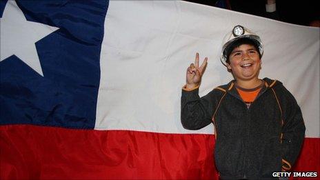 A Chilean boy celebrates in Plaza Italia