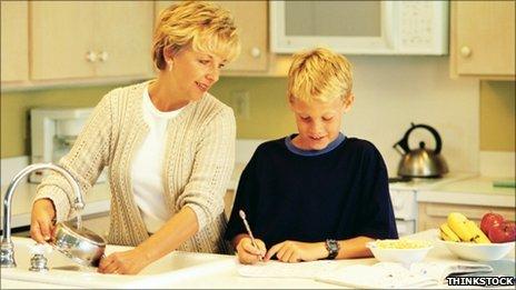 Woman doing housework and helping child with homework