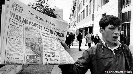 A newspaper with a banner headline reporting the invoking of the War Measures Act, in Ottawa, 16 Oct 1970 (Image copyright Canadian Press)