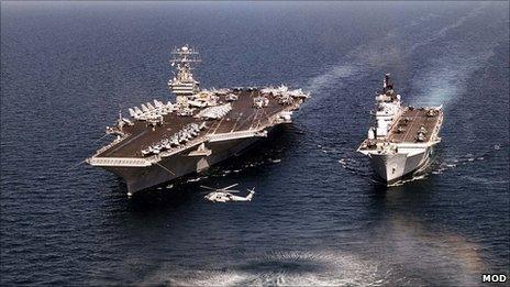 A current US carrier against a current UK one (HMS Illustrious)