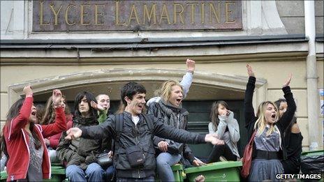 High school students block the entrance to the Lamartine high school in Paris, on 12 October 2010, to protest against the government reform bill on pensions.