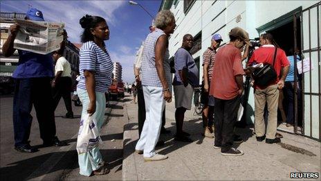 People queue to buy a copy of the Official Gazette in Havana