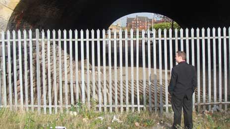 Man at entrance to tunnel