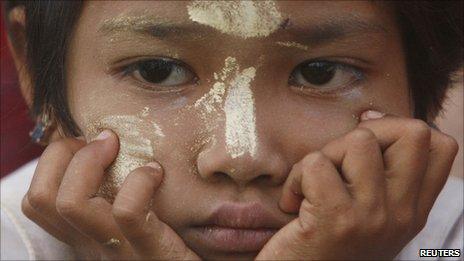 A Mon girl attends a ceremony in Mawlamyaing village near the Burma-Thai border on 28 August 2007